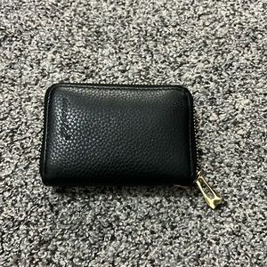 black wallet with 12 card holders and 2 money slots